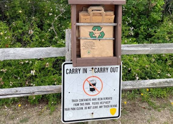 Carry In/Carry Out recycling bag dispenser