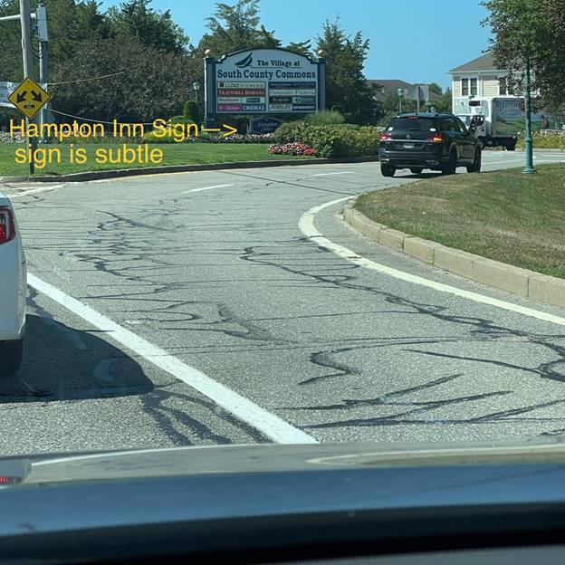 A car driving down a road

Description automatically generated with low confidence
