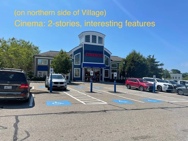 A parking lot with cars and a building in the background

Description automatically generated with medium confidence